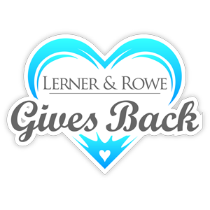 Logo of "lerner & rowe gives back" featuring a turquoise heart